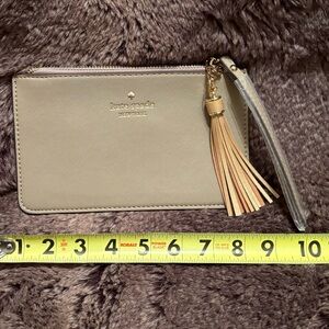 Kate Spade Tan Wristlet with Tassel Detail